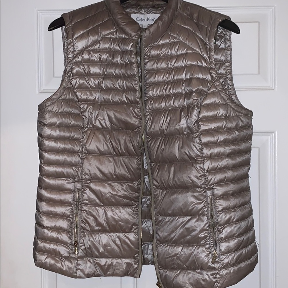 A silver vest. Used.